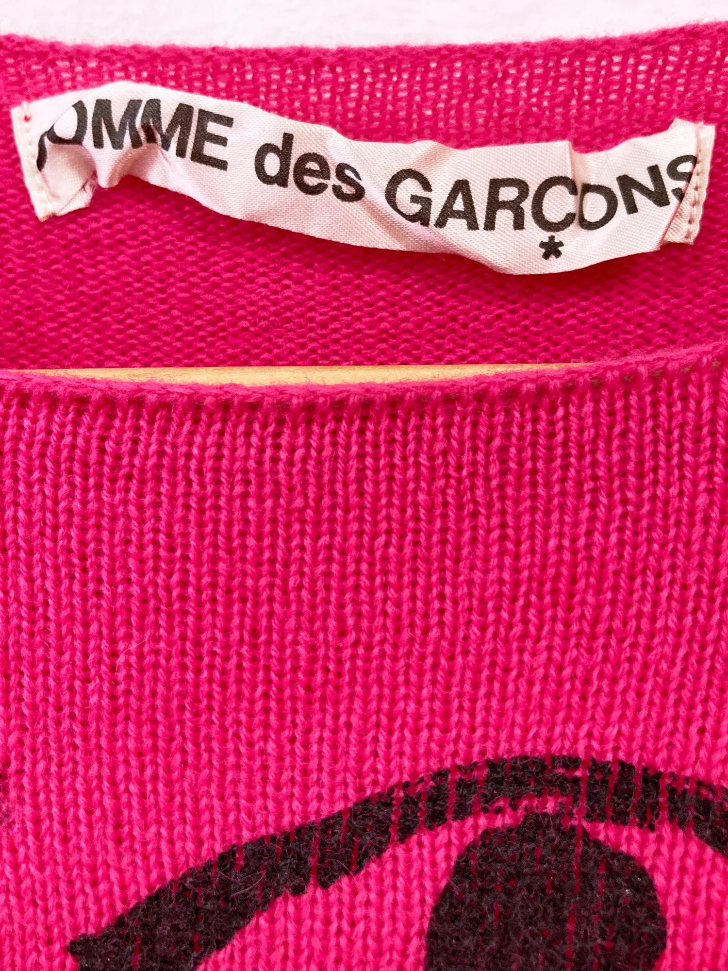 Comme des Garcons AW2000 pink wool knit sweater with eyes on front